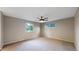 Spacious bedroom with neutral tones, carpet flooring, and a ceiling fan at 8663 E Davies Ave, Centennial, CO 80112