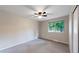 Cozy bedroom boasts neutral walls, plush carpet, and a bright window at 8663 E Davies Ave, Centennial, CO 80112