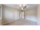 Bedroom showcasing neutral walls, plush carpet, ceiling fan, and a closet at 8663 E Davies Ave, Centennial, CO 80112