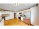 Spacious kitchen features ample white cabinetry and stainless steel appliances at 8663 E Davies Ave, Centennial, CO 80112