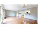 Open concept living area boasts hardwood floors and natural light, with a pass-through to a modern kitchen at 8663 E Davies Ave, Centennial, CO 80112