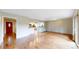 Hardwood floors flow throughout this expansive living room that leads to a modern kitchen and front door at 8663 E Davies Ave, Centennial, CO 80112