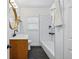 Modern bathroom with vanity, shiplap accents, and subway tile in shower at 4720 Perry St, Denver, CO 80212