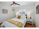 Bright bedroom features a ceiling fan, neutral walls, a window and an abundance of natural light at 4720 Perry St, Denver, CO 80212