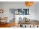 Open concept dining room and kitchen featuring hardwood floors and updated appliances at 4720 Perry St, Denver, CO 80212