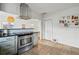 Updated kitchen with stainless steel appliances and granite countertops at 4720 Perry St, Denver, CO 80212