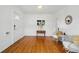Spacious living area featuring hardwood floors, neutral decor, and an open and airy feel at 4720 Perry St, Denver, CO 80212