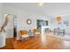 Bright living room with hardwood floors, modern decor, and an open layout to the kitchen at 4720 Perry St, Denver, CO 80212