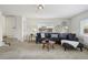 Spacious living room with neutral walls and carpet, and stairs to an upper level at 4720 Perry St, Denver, CO 80212