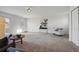 Spacious living room with neutral walls and carpet, a window and an abundance of natural light at 4720 Perry St, Denver, CO 80212