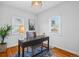 Home office features a desk, neutral walls, a window and natural light at 4720 Perry St, Denver, CO 80212
