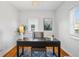 Home office features a desk, neutral walls, a window and natural light at 4720 Perry St, Denver, CO 80212