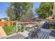 Charming back deck features a seating area and is the perfect spot for enjoying the outdoors at 3645 S Fox St, Englewood, CO 80110
