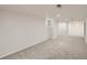Spacious basement featuring carpeted flooring, white walls, and natural lighting at 3645 S Fox St, Englewood, CO 80110