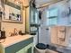 A stylish bathroom features a vanity with a mirror and a shower with glass doors at 3645 S Fox St, Englewood, CO 80110