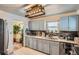 Well-lit kitchen with modern cabinets, countertops, and appliances, offering a functional and stylish space at 3645 S Fox St, Englewood, CO 80110