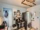 Contemporary kitchen with stainless steel appliances and a statement-making rustic light fixture at 3645 S Fox St, Englewood, CO 80110