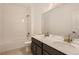 Bright bathroom featuring a double sink vanity, shower-tub combination, and neutral color palette at 747 Sunflower Dr, Brighton, CO 80601