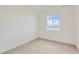 Bedroom featuring neutral carpet and a window providing natural light at 747 Sunflower Dr, Brighton, CO 80601