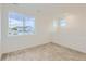 Upstairs bonus room with plush carpet and bright natural light from large window at 747 Sunflower Dr, Brighton, CO 80601