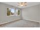Bright bedroom features carpet and large windows letting in plenty of natural light at 857 S Van Gordon Ct # H101, Lakewood, CO 80228
