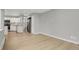 Open-concept living and kitchen area with hardwood floors and neutral paint throughout at 857 S Van Gordon Ct # H101, Lakewood, CO 80228