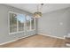 Bright living room features large windows letting in plenty of natural light and hardwood floors at 857 S Van Gordon Ct # H101, Lakewood, CO 80228