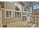 Private front patio with views enhances natural light with a wrought iron fence detail at 857 S Van Gordon Ct # H101, Lakewood, CO 80228