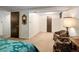 Spacious bedroom with wall-to-wall carpet with neutral walls and trim, and an additional seating area at 1288 S Drexel Way, Lakewood, CO 80232