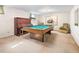 Basement game room featuring a billiard table, a piano, and ample space at 1288 S Drexel Way, Lakewood, CO 80232