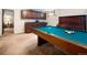 Spacious basement game room with a billiard table and custom cabinets at 1288 S Drexel Way, Lakewood, CO 80232