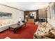 Comfortable living room with a fireplace and lots of natural light from the window at 1288 S Drexel Way, Lakewood, CO 80232