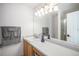 Bright bathroom with a long countertop, double sinks, and decorative purple vase at 9626 Whitecliff Pl, Highlands Ranch, CO 80129