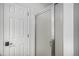Bathroom featuring a glass-enclosed shower and white door at 9626 Whitecliff Pl, Highlands Ranch, CO 80129