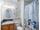 Charming bathroom with decorative shower curtain and snowman figures at 9626 Whitecliff Pl, Highlands Ranch, CO 80129