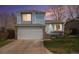 Charming two-story home with blue siding, brick accents, and a well-maintained front yard at 9626 Whitecliff Pl, Highlands Ranch, CO 80129