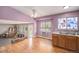 Spacious living area with hardwood floors, ample natural light, and neutral decor at 9626 Whitecliff Pl, Highlands Ranch, CO 80129