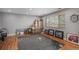 Spacious living room with hardwood floors, a large window, and a patterned rug at 9626 Whitecliff Pl, Highlands Ranch, CO 80129