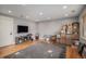 Living room with hardwood floors, a fireplace, and a large area rug at 9626 Whitecliff Pl, Highlands Ranch, CO 80129