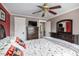 Bedroom features furniture, neutral wall colors, and a ceiling fan at 9626 Whitecliff Pl, Highlands Ranch, CO 80129