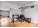 Open floor plan office space featuring hardwood flooring and natural light at 9626 Whitecliff Pl, Highlands Ranch, CO 80129