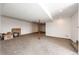 Large finished basement area with neutral carpeting, white walls, and visible support beam at 28505 County Road 5, Elizabeth, CO 80107