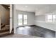 Finished basement area featuring gray tile floors, a white wall, and access to the outside at 28505 County Road 5, Elizabeth, CO 80107