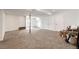 Open finished basement with neutral carpeting, white walls, storage, and natural light at 28505 County Road 5, Elizabeth, CO 80107