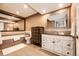 Finished bathroom featuring tile flooring, tile walls, a vanity, and soaking tub at 28505 County Road 5, Elizabeth, CO 80107