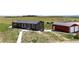 Exterior view of the home on acreage with outbuildings at 28505 County Road 5, Elizabeth, CO 80107