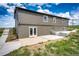 A serene backyard view featuring a charming patio and well-maintained stairs, perfect for outdoor living at 28505 County Road 5, Elizabeth, CO 80107