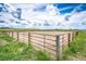 Beautiful horse arena, fenced and ready, with green grass and a big sky at 28505 County Road 5, Elizabeth, CO 80107