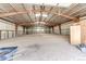 Spacious indoor arena with metal beams, ample natural light and a dirt floor at 28505 County Road 5, Elizabeth, CO 80107