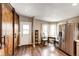 Charming kitchen with stainless steel appliances, dining area, and rustic sliding barn door at 28505 County Road 5, Elizabeth, CO 80107
